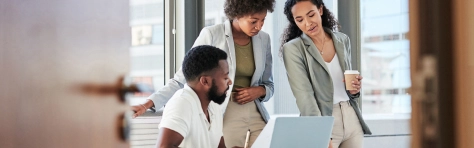 An image of colleagues working together in an office environment