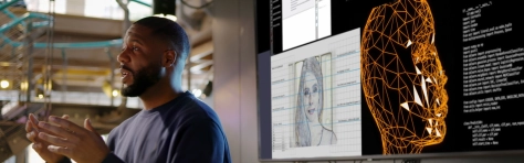 Image of a man conducting a seminar on the creation of AI