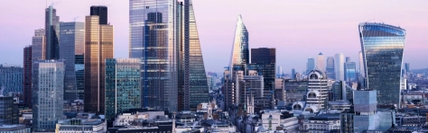 A view of the financial district and Canary Wharf against sky at dusk