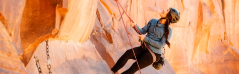 An image of a women rock climbing