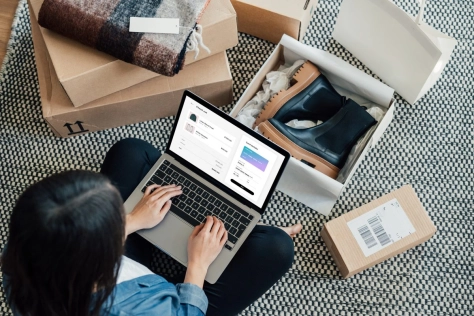 woman writing to notebook and sending some packages