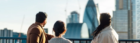 Image of co-workers looking out across the cityscape of London.