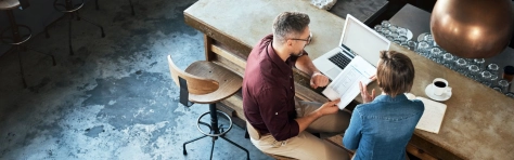 Business owner sitting at table planning business exit