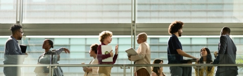 An image of a group of payroll colleagues in discussion.