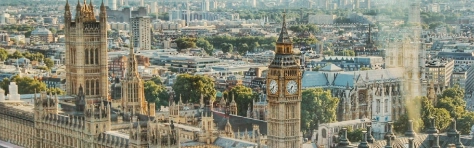 Aerial view of UK Houses of Parliament on a sunny day in central London. British government building with Big Ben.