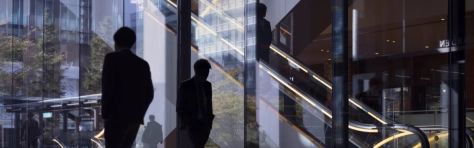 Morning image with office workers passing modern office facade in Tokyo, Japan -Office Block Exterior Business City Japan The Way Forward Building Exterior Conformity Walking Commuter High Contrast People Dawn Glass