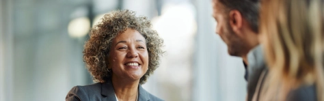 Insurance employees assessing  IFRS 18 in the workplace