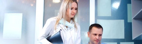 Nurse and doctor in the office. Dentist Computer Assistant Adult Adults Only Analysing Assistance Business Finance and Industry Care Caucasian Ethnicity Centers for Medicare and Medicaid Services Clinic Desk Doctor Employment Issues Expertise Females General Practitioner Healthcare And Medicine Healthcare Worker Holding Horizontal Hospital Indoors Laptop Looking Males Medical Examination Medical Occupation Medical Procedure Medicine Men