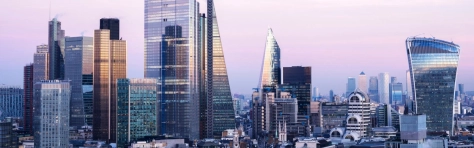 An image of the financial district and Canary Wharf against sky at dusk