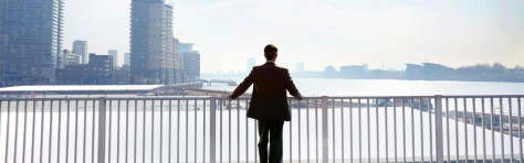 A businessman looking out over the city