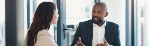 two business associates discussing UK SRS S2