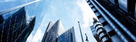 UK, London, low angle view of city financial district skyline illuminated at sunset