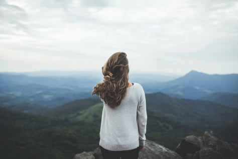 woman sitting on the clif