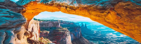 A picture of a sunrise over a canyon