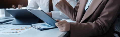 Forvis Mazars team checking the document to Understanding Cabinet Decision No. 106 of 2025 on eInvoicing violations