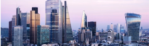 UK, London, elevated view over the city financial district skyline at sunset