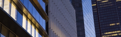 Close-up of modern office facades at business district at dawn