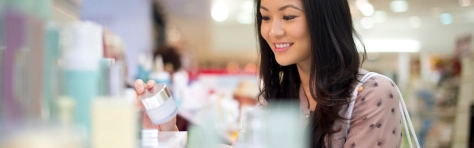 young woman shopping for make up -Shopping Retail Cosmetics Make-Up