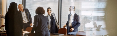 a group of people in a meeting 