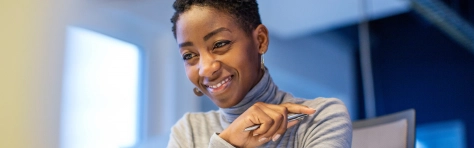 Woman smiling thinking about Solvency II reforms. 