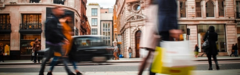 People walking down busy street