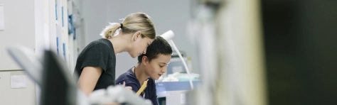 Two young female technicians working in a hospital workshopLaboratory, Phial, Vaccination, Insulin, Healthcare And Medicine, Medicine, Plain Background, Close-Up, Production Line, Macrophotography, Science, Bottle, Glass - Material, Container, Group Of Objects, No People, Transparent, Copy Space, Liquid, Equipment
