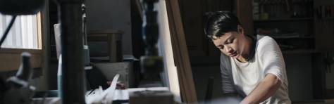 Young female carpenter working ina a workshop - Small Business, Carpenter, Working, Craftsperson, One Woman Only, Construction Industry, Craft, Carpentry, Effort, Only Women, Workshop, Candid, People, Wood - Material, Skill