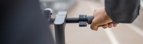 Man in suit riding bike