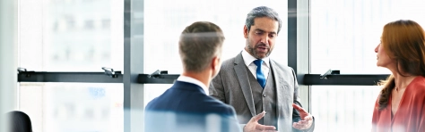 Business people in a modern office discussing plans
