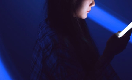 Woman reading a guide to Agentic AI
