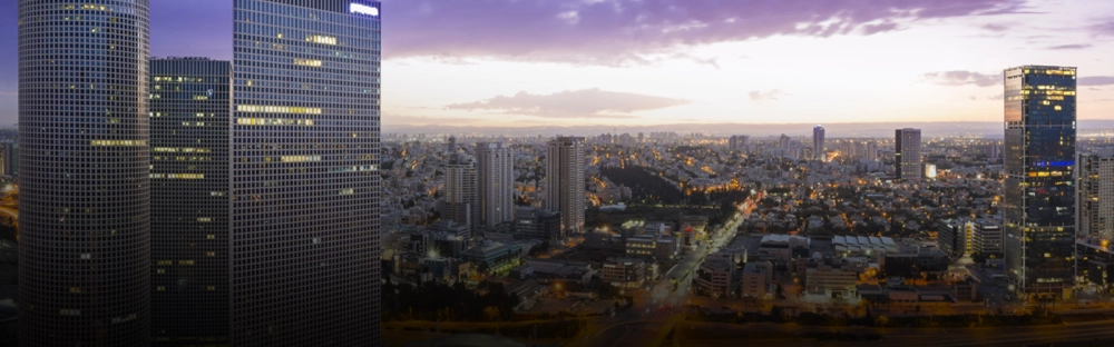 e8d493af0a73-Tel-Aviv-offices-buildings-skyline-modern-purple-sky-header-1600x700.jpg.webp