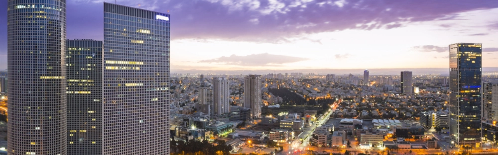 0f736404ceb4-Tel-Aviv-offices-buildings-skyline-modern-purple-sky-social-1200x627.jpg.webp