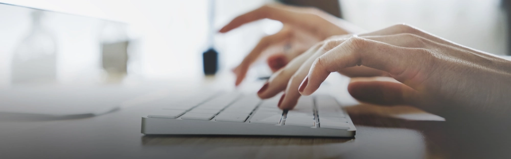 394738ffc0c3-Woman-typing-computer-header-1600x700.jpg.webp 394738ffc0c3-Woman-typing-computer-header-1600x700.jpg.webp