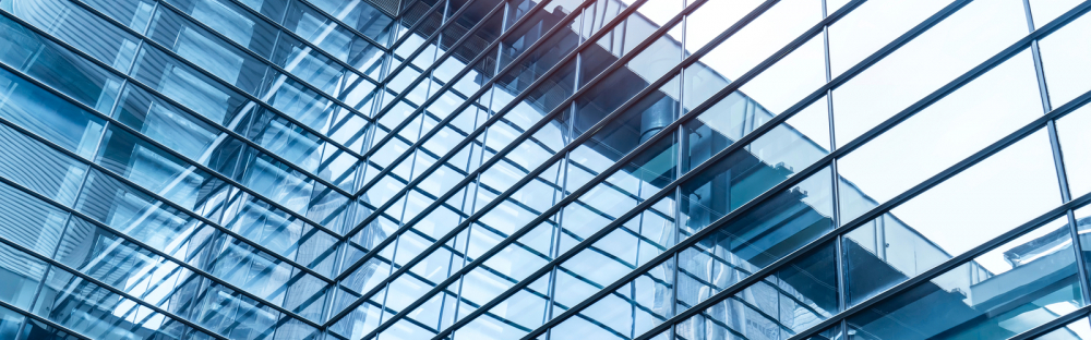 32a9ea15e532-Glass-building-silver-blue-header.jpg