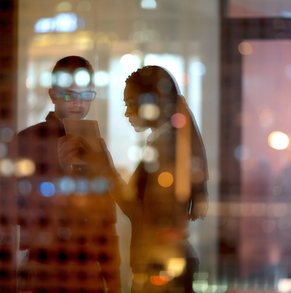 People-people standing-reflection of city