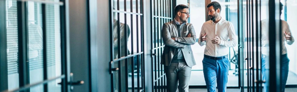 Business-men-walking-and-talking.jpg