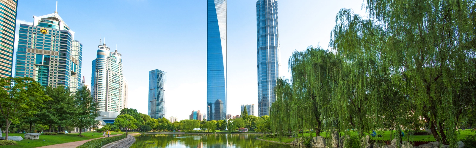 buildings - green - river - water - city