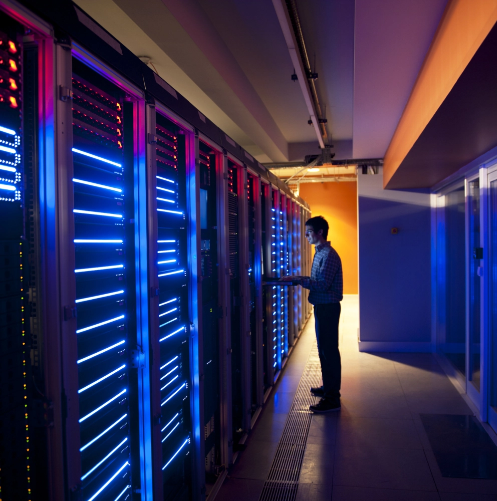 Cybersecurity specialist managing servers in a secure data centre environment.